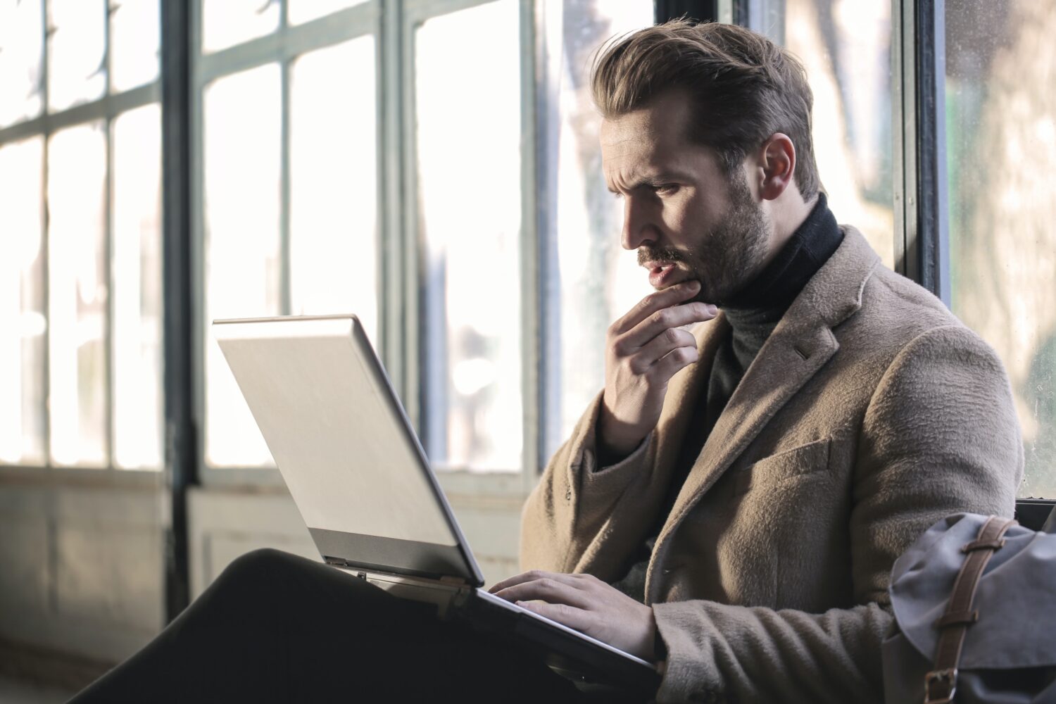student looking at his laptop