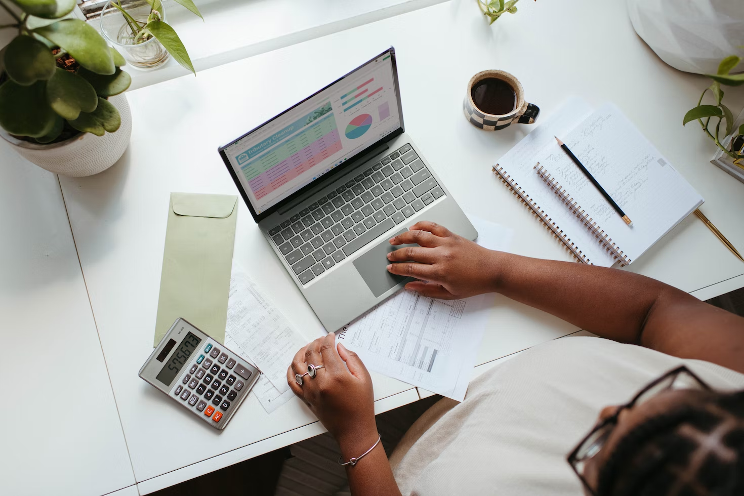 A healthcare administrator makes financial management decisions while working.